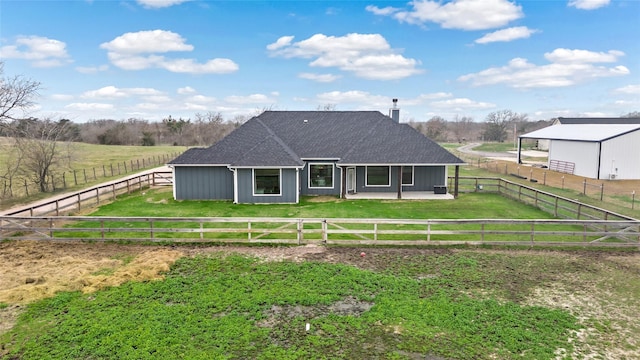12078 County Road 175, Iola, TX 77861 - rear view of property with a patio, a shingled roof, and a rural view