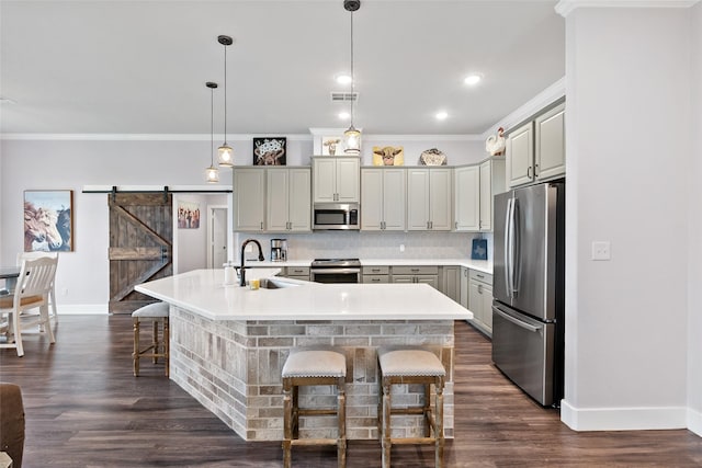 12078 County Road 175, Iola, TX 77861 - kitchen featuring stainless steel appliances, a sink, baseboards, a breakfast bar, and crown molding