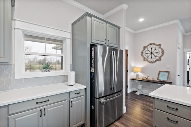 12078 County Road 175, Iola, TX 77861 - kitchen with freestanding refrigerator, gray cabinets, backsplash, ornamental molding, and light countertops