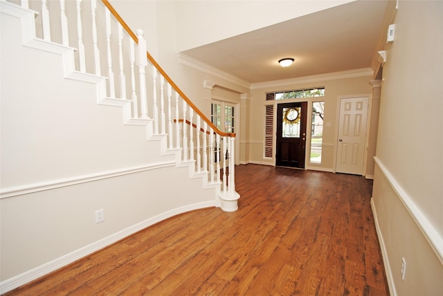 1902 Rosebay Ct, Sugar Land, TX 77479 - foyer entrance featuring ornamental molding, wood finished floors, stairs, and baseboards