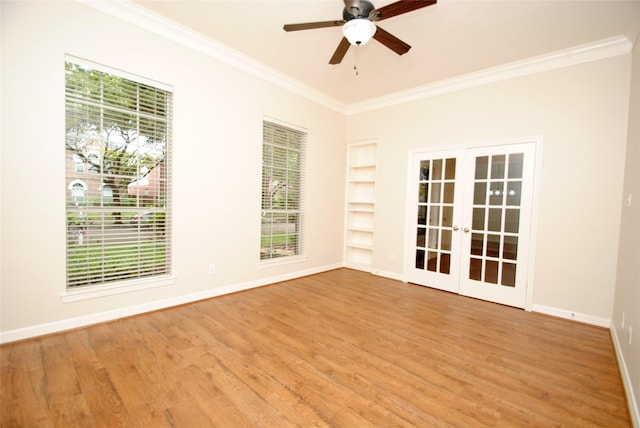 1902 Rosebay Ct, Sugar Land, TX 77479 - unfurnished room with french doors, crown molding, built in shelves, light wood finished floors, and ceiling fan
