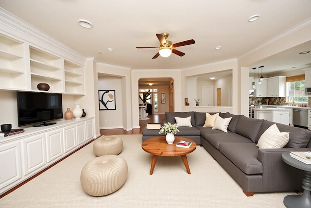 1902 Rosebay Ct, Sugar Land, TX 77479 - living area featuring a ceiling fan, arched walkways, crown molding, recessed lighting, and wood finished floors