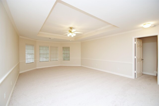 1902 Rosebay Ct, Sugar Land, TX 77479 - unfurnished room featuring a tray ceiling, crown molding, light carpet, a ceiling fan, and baseboards