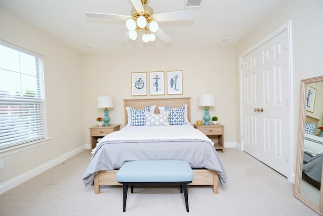 1902 Rosebay Ct, Sugar Land, TX 77479 - bedroom with light colored carpet, a closet, baseboards, and a ceiling fan