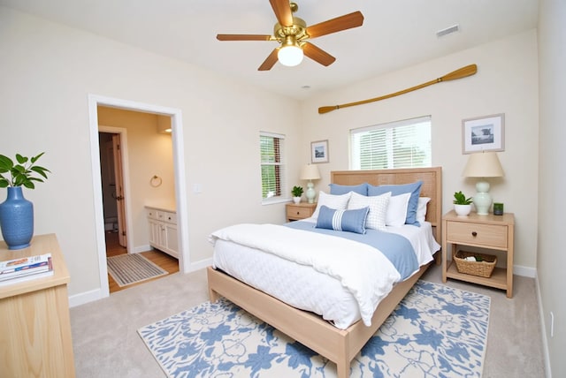 1902 Rosebay Ct, Sugar Land, TX 77479 - carpeted bedroom with connected bathroom, baseboards, and a ceiling fan