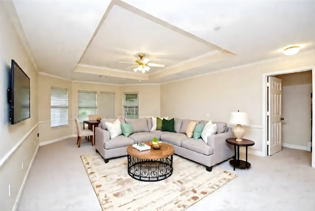 1902 Rosebay Ct, Sugar Land, TX 77479 - carpeted living room featuring a tray ceiling, a ceiling fan, baseboards, and crown molding