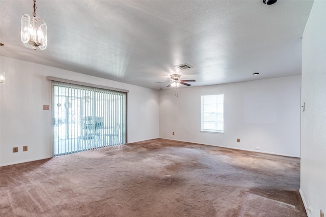 119 Delaware Dr, Conroe, TX 77316 - carpeted empty room featuring a chandelier, ceiling fan, and baseboards