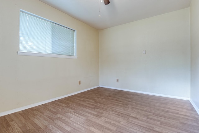 119 Delaware Dr, Conroe, TX 77316 - empty room with light wood-style floors, baseboards, and a ceiling fan