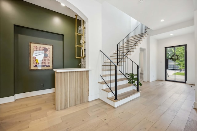 1913 Ebony Ln, Houston, TX 77018 - indoor bar with light wood-style flooring, stairway, arched walkways, and recessed lighting