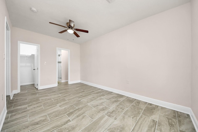 4918 Perry St, Houston, TX 77021 - unfurnished bedroom with baseboards, a closet, ceiling fan, and a spacious closet