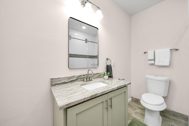 4918 Perry St, Houston, TX 77021 - bathroom featuring vanity, toilet, and baseboards