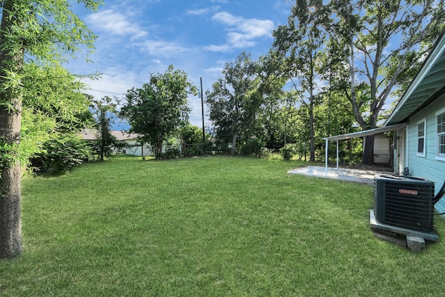 4918 Perry St, Houston, TX 77021 - view of grassy yard with central AC and a patio
