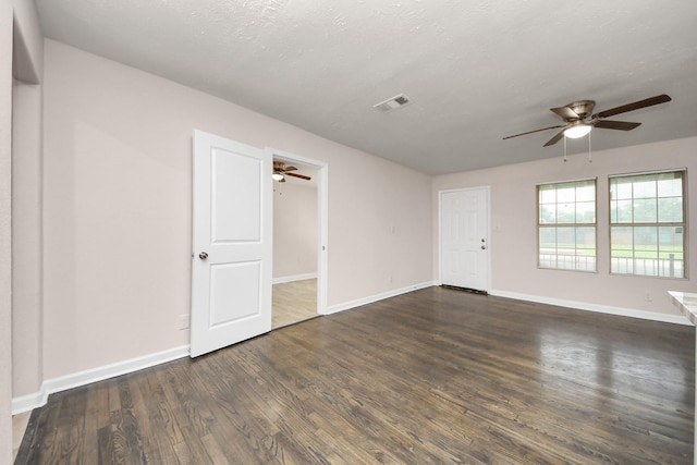 4918 Perry St, Houston, TX 77021 - unfurnished room featuring ceiling fan, dark wood-style floors, and baseboards