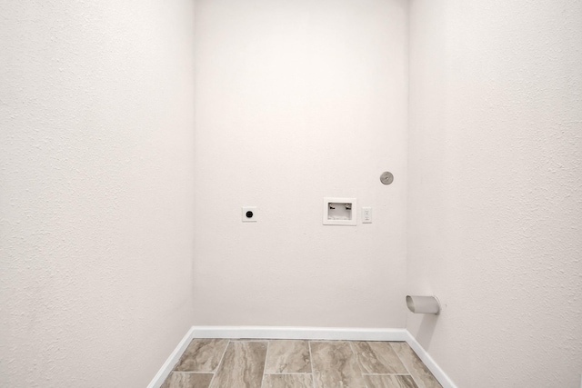 4918 Perry St, Houston, TX 77021 - laundry area featuring hookup for an electric dryer, baseboards, and hookup for a washing machine