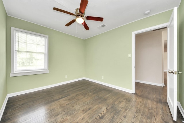 4918 Perry St, Houston, TX 77021 - spare room featuring dark wood-style flooring, crown molding, baseboards, a ceiling fan, and a smoke detector