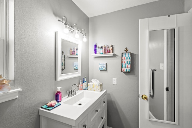 13755 Shirebrook Dr N, Sugar Land, TX 77498 - bathroom with vanity and a textured wall