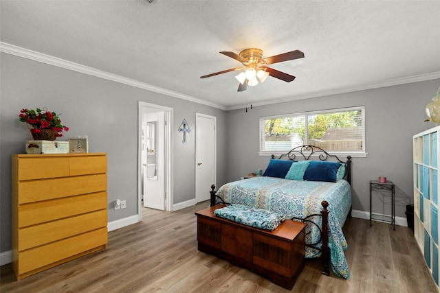 13755 Shirebrook Dr N, Sugar Land, TX 77498 - bedroom featuring wood finished floors, baseboards, ornamental molding, a textured ceiling, and a ceiling fan