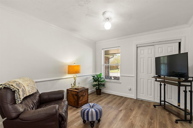 13755 Shirebrook Dr N, Sugar Land, TX 77498 - sitting room featuring ornamental molding, wood finished floors, ceiling fan, and baseboards