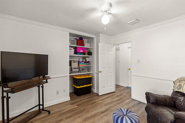 13755 Shirebrook Dr N, Sugar Land, TX 77498 - living room featuring ornamental molding, wood finished floors, a ceiling fan, and baseboards