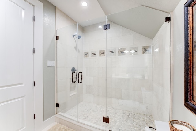 321 Marina Dr, Coldspring, TX 77331 - full bathroom with a stall shower, recessed lighting, vaulted ceiling, and baseboards