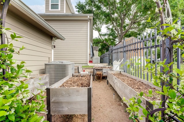 321 Marina Dr, Coldspring, TX 77331 - view of patio / terrace with a vegetable garden and central AC