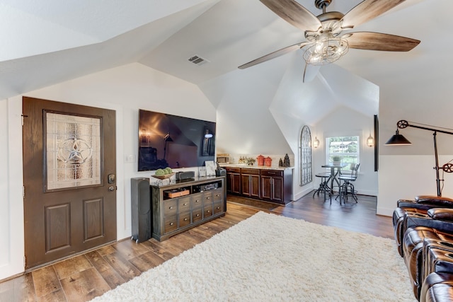 321 Marina Dr, Coldspring, TX 77331 - living room with ceiling fan, vaulted ceiling, wood finished floors, and baseboards