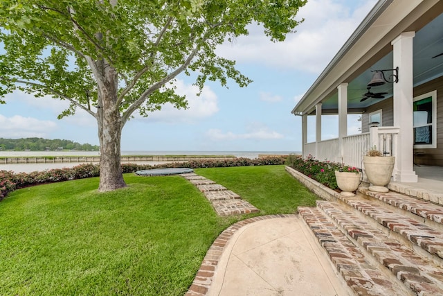 321 Marina Dr, Coldspring, TX 77331 - view of grassy yard featuring a water view and a ceiling fan