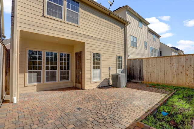 2617 Edgefield Lakes Dr, Houston, TX 77054 - fenced backyard with central air condition unit and a patio