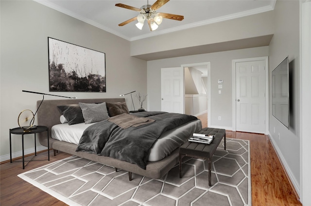 2617 Edgefield Lakes Dr, Houston, TX 77054 - bedroom featuring crown molding, wood finished floors, baseboards, and ceiling fan