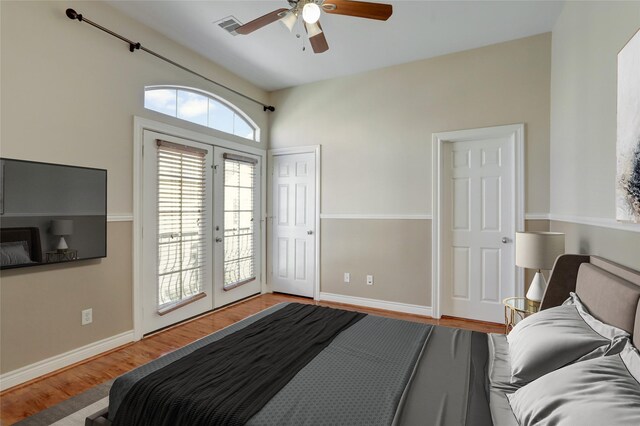 2617 Edgefield Lakes Dr, Houston, TX 77054 - bedroom featuring access to outside, french doors, wood finished floors, baseboards, and ceiling fan