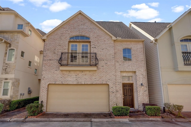 2617 Edgefield Lakes Dr, Houston, TX 77054 - view of front of property with a balcony, brick siding, and an attached garage