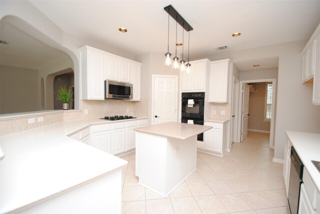 16611 Hope Farm Ln, Cypress, TX 77429 - kitchen with black appliances, decorative backsplash, light countertops, and recessed lighting