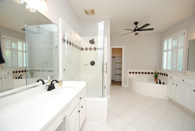 16611 Hope Farm Ln, Cypress, TX 77429 - bathroom with ceiling fan, vanity, a shower stall, a bath, and plenty of natural light