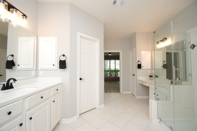 16611 Hope Farm Ln, Cypress, TX 77429 - full bath with vanity, a stall shower, tile patterned flooring, and baseboards