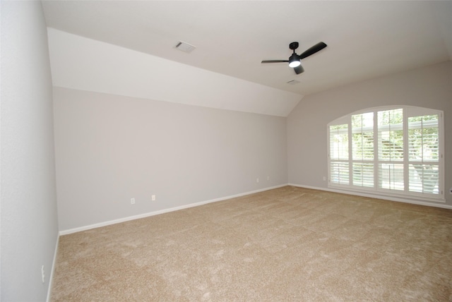 16611 Hope Farm Ln, Cypress, TX 77429 - empty room with light carpet, vaulted ceiling, ceiling fan, and baseboards