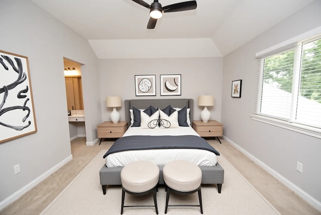 16611 Hope Farm Ln, Cypress, TX 77429 - bedroom featuring light carpet, lofted ceiling, connected bathroom, baseboards, and a ceiling fan