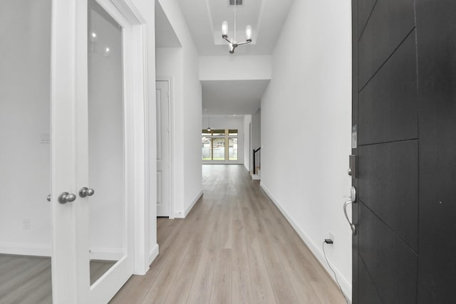 21111 Flowerhorn Dr, Cypress, TX 77433 - hall featuring light wood-type flooring, baseboards, and a chandelier