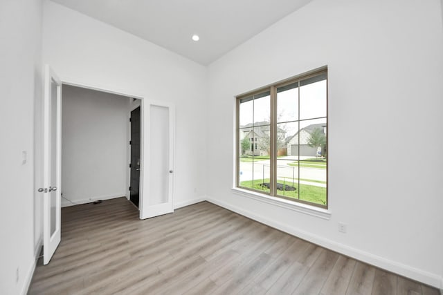 21111 Flowerhorn Dr, Cypress, TX 77433 - unfurnished room with light wood-style floors, baseboards, and recessed lighting