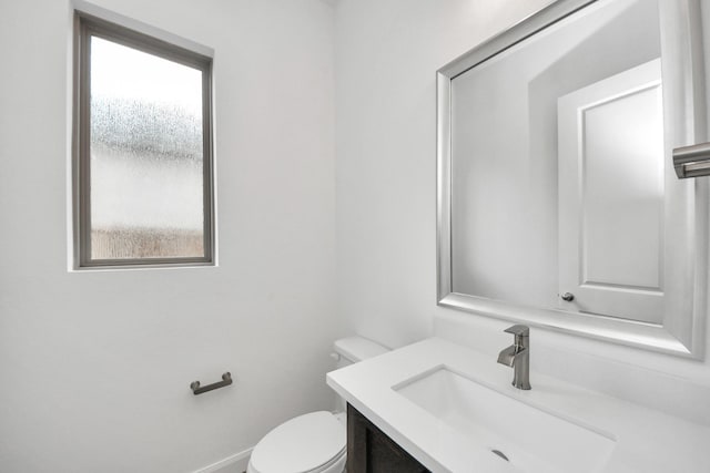 21111 Flowerhorn Dr, Cypress, TX 77433 - half bathroom featuring vanity, toilet, and baseboards