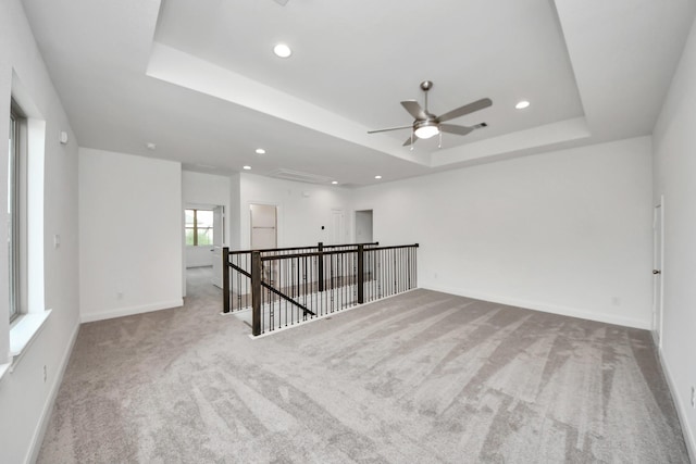 21111 Flowerhorn Dr, Cypress, TX 77433 - spare room with a tray ceiling, carpet, attic access, ceiling fan, and recessed lighting