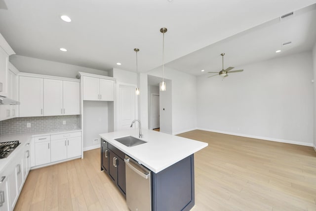 21114 Flowerhorn Dr, Cypress, TX 77433 - kitchen with stainless steel appliances, a sink, light countertops, ceiling fan, and recessed lighting