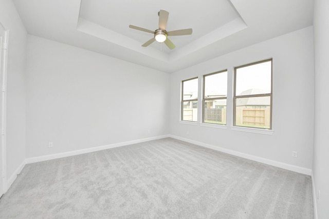 21114 Flowerhorn Dr, Cypress, TX 77433 - unfurnished room with a tray ceiling, carpet flooring, baseboards, and ceiling fan