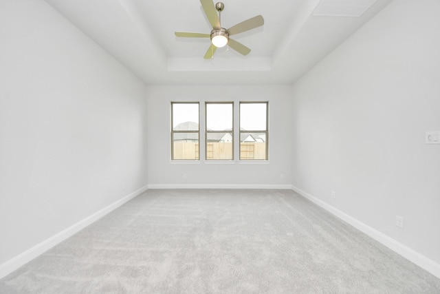 21114 Flowerhorn Dr, Cypress, TX 77433 - spare room with a tray ceiling, ceiling fan, light carpet, and baseboards