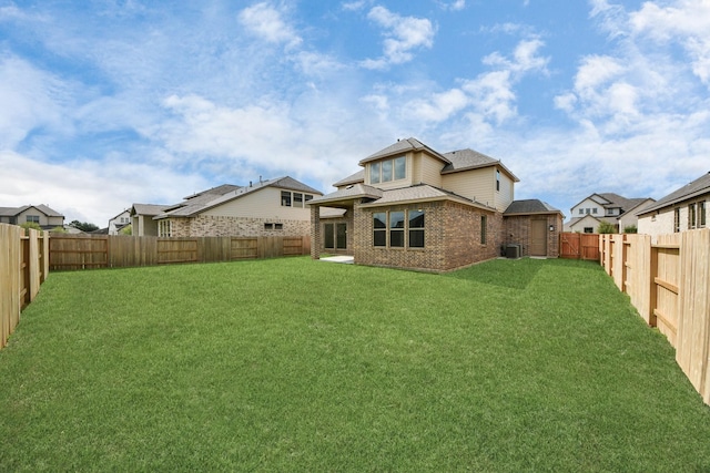 21114 Flowerhorn Dr, Cypress, TX 77433 - back of house featuring brick siding, central AC, and roof with shingles