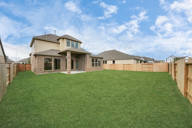 21114 Flowerhorn Dr, Cypress, TX 77433 - back of house featuring a shingled roof, brick siding, and a patio
