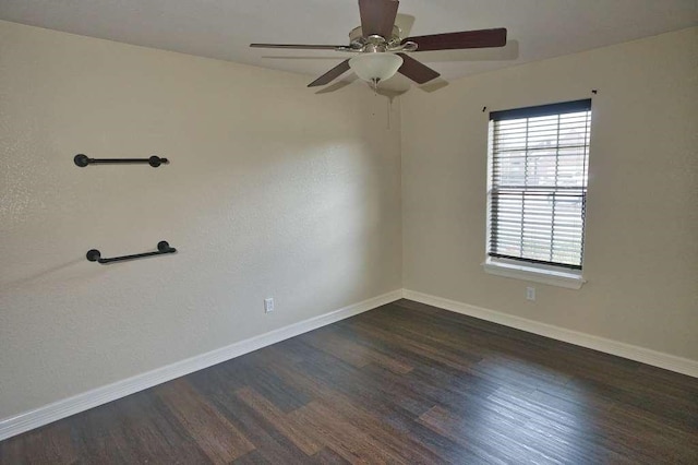107 Brazos Ct, Richwood, TX 77531 - spare room with dark wood-style flooring, a ceiling fan, and baseboards