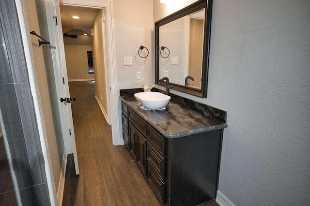 107 Brazos Ct, Richwood, TX 77531 - bathroom featuring a textured wall, wood finished floors, vanity, and baseboards