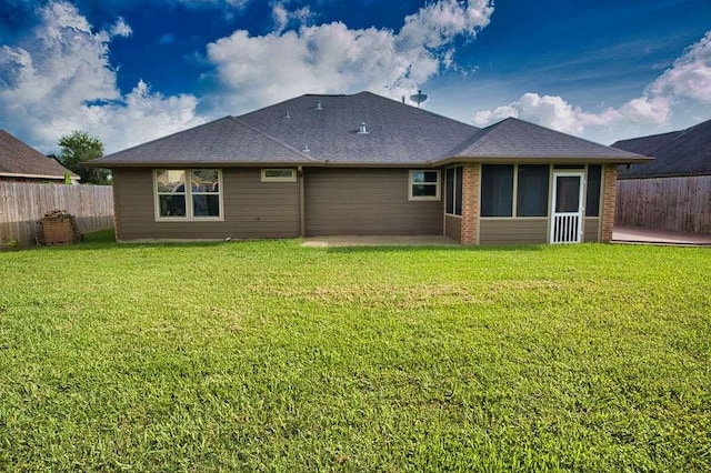 107 Brazos Ct, Richwood, TX 77531 - back of property with a sunroom, a patio area, and roof with shingles