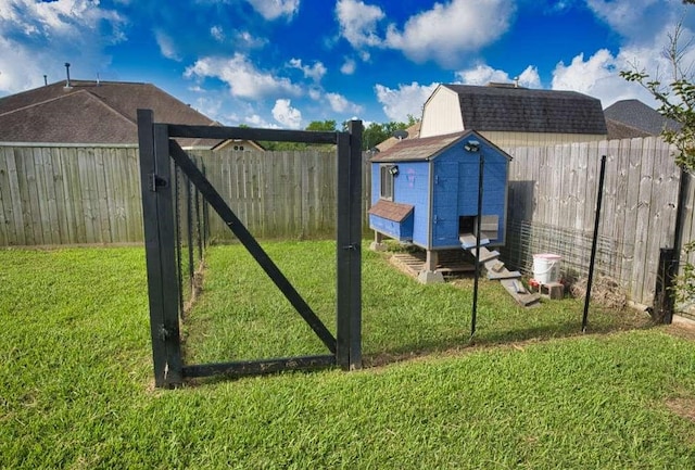107 Brazos Ct, Richwood, TX 77531 - view of yard featuring an outbuilding and exterior structure