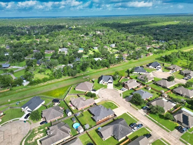 107 Brazos Ct, Richwood, TX 77531 - aerial overview of property's location featuring nearby suburban area and a forest